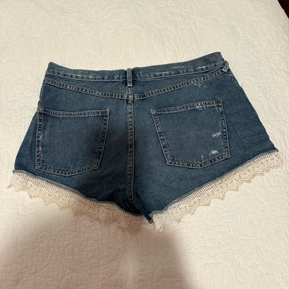 Free People size 30 jean shorts trimmed with lace - Picture 2 of 3